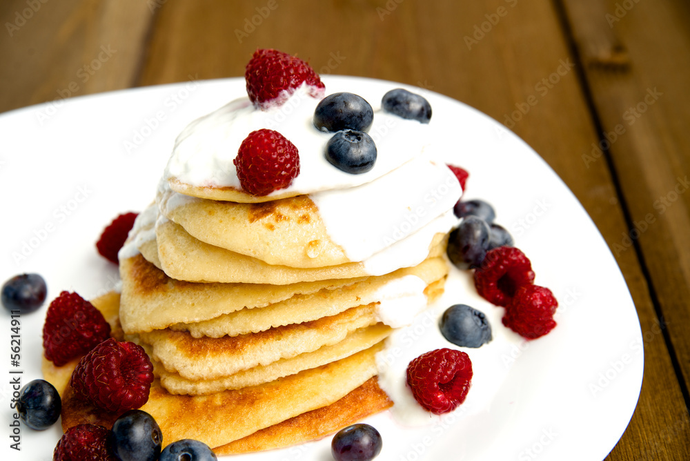 Homemade pancakes on a wooden table Homemade pancakes on a wooden table