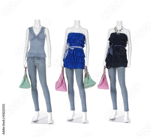 female clothing in blue jeans with bag on three mannequin