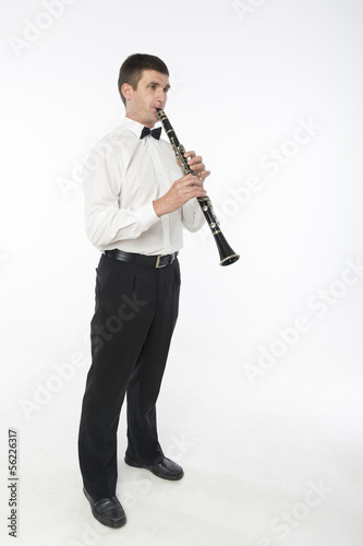 Handsome man plays clarinet