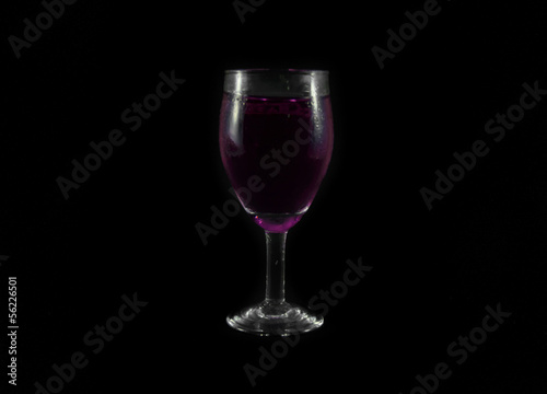 purple water drink in wine glass