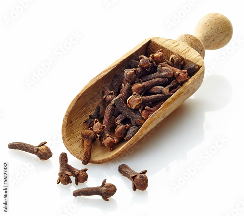 wooden scoop with cloves photo