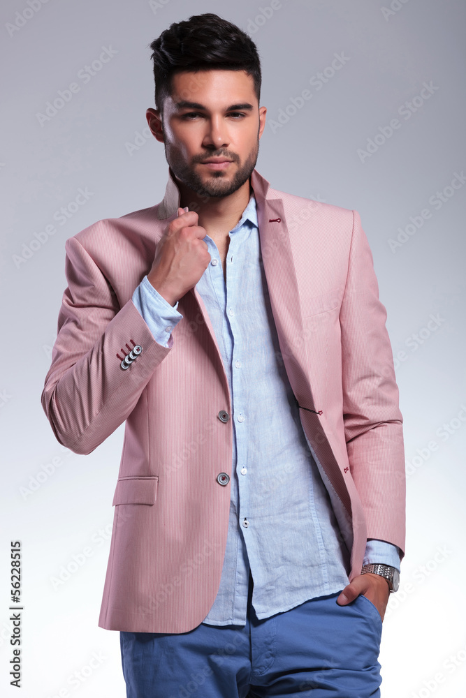 casual man with hand on lapel and in pocket casual man with hand on lapel and in pocket
