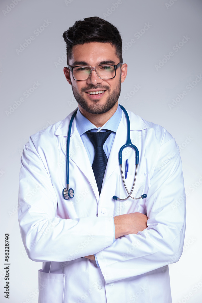 young doctor with folded arms young doctor with folded arms