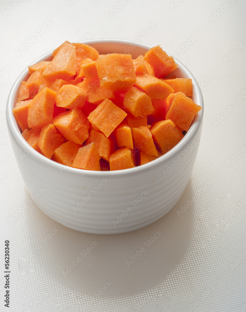 cut carrot in a bowl on white background cut carrot in a bowl on white background