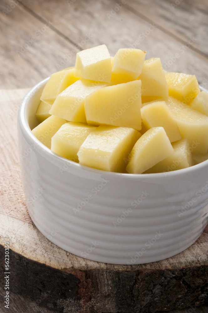 cut raw potatoes in bowl cut raw potatoes in bowl