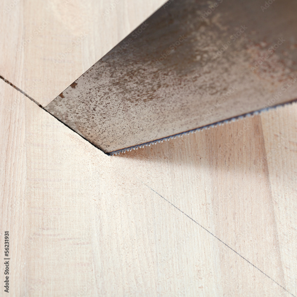 wooden board is cut with hacksaw wooden board is cut with hacksaw