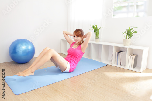 healthy young woman doing yoga at home