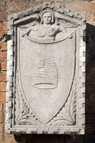 Medieveal bas relief Burano Venice photo