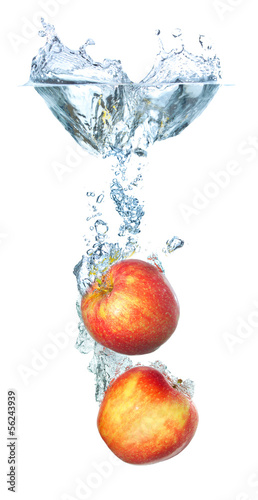 Juicy apples and water splash. Healthy and tasty food