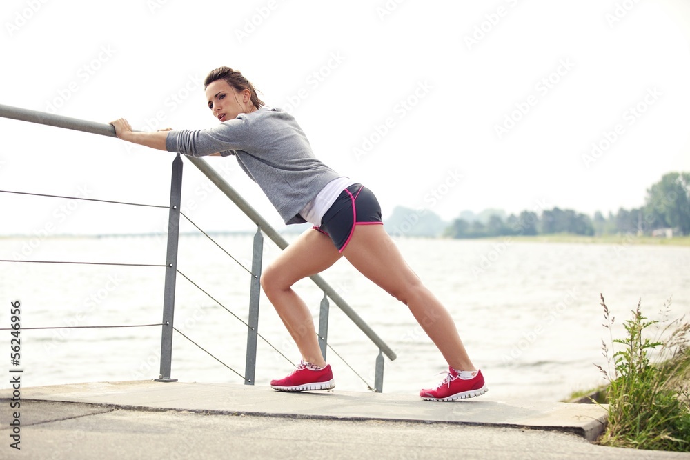 Female Runner Stretching Before Run