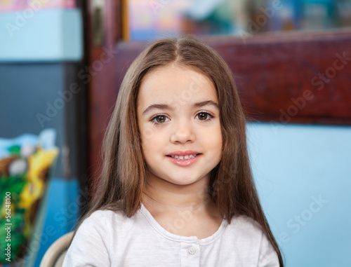 Cute Girl Smiling In Kindergarten