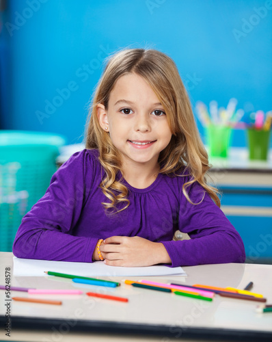 Girl With Sketch Pens And Paper In Kindergarten