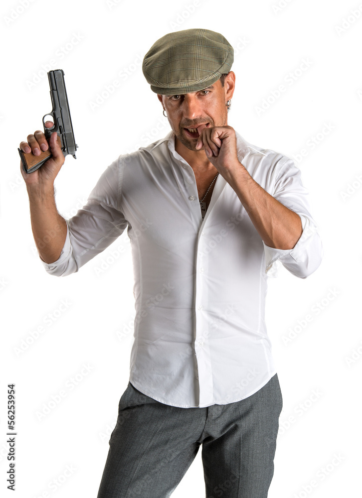 Handsome man in cap with a gun Handsome man in cap with a gun