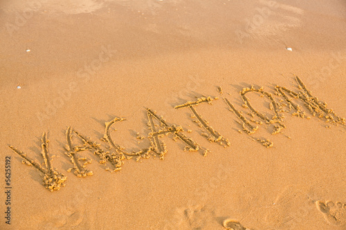 Word vacation on the yellow sandy beach © len44ik