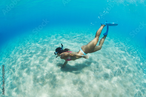 Woman snorkeling in tropical sea