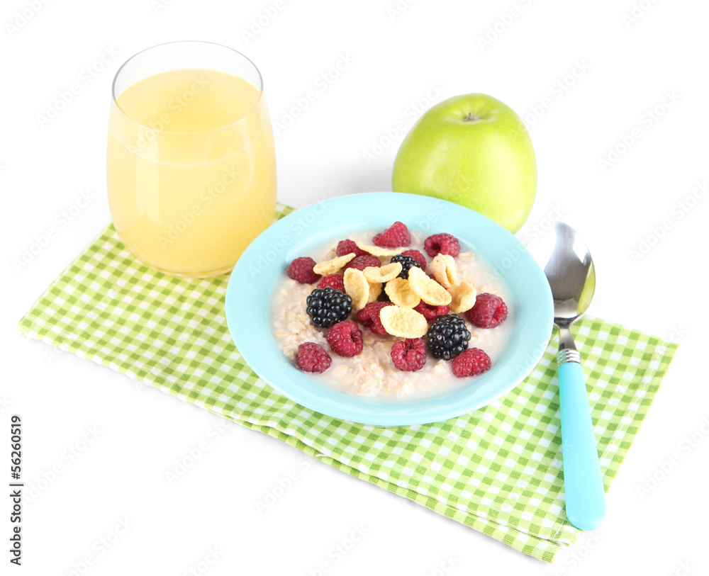 Oatmeal in bowl with berries isolated on white Oatmeal in bowl with berries isolated on white
