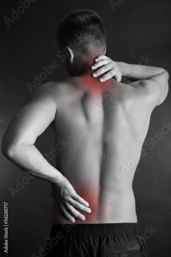 Young man with back pain on...