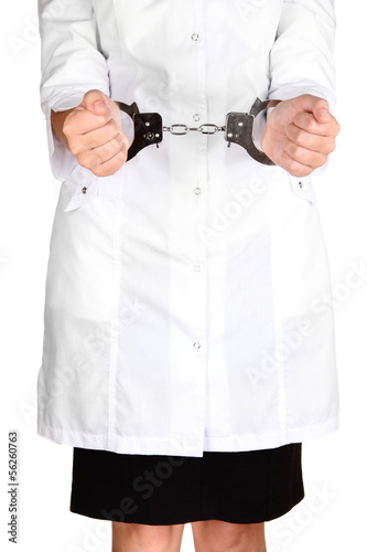 Doctor in handcuffs isolated on white