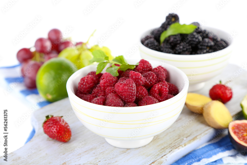 Raspberries and blackberry in small bowls Raspberries and blackberry in small bowls