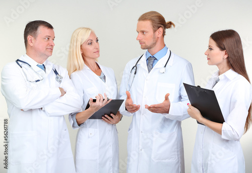 Medical workers on grey bac...