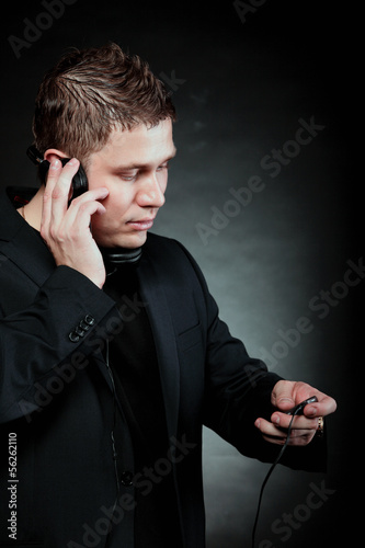 young man with headphones use mp3 music player