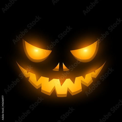 Halloween scary illuminated face in the dark
