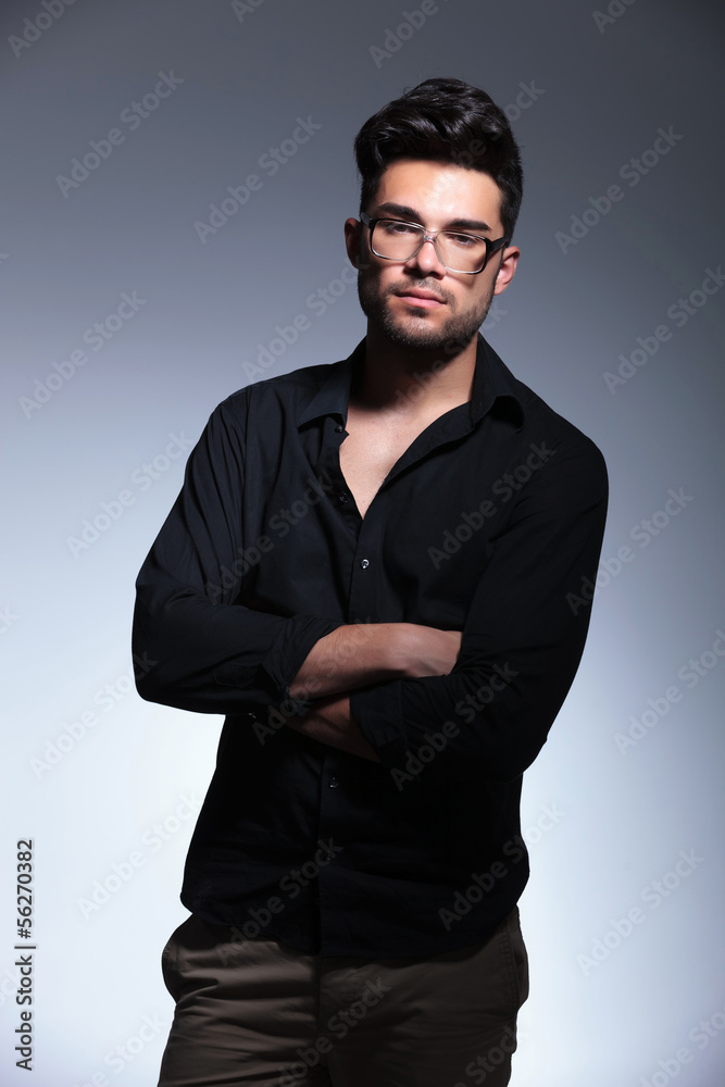 Obraz premium young fashion man with crossed hands