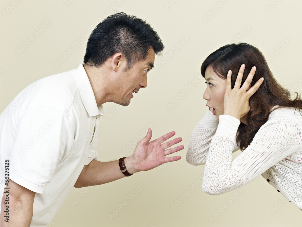 young asian couple shouting at each other young asian couple shouting at each other