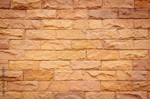 A brick wall in different natural orange tones
