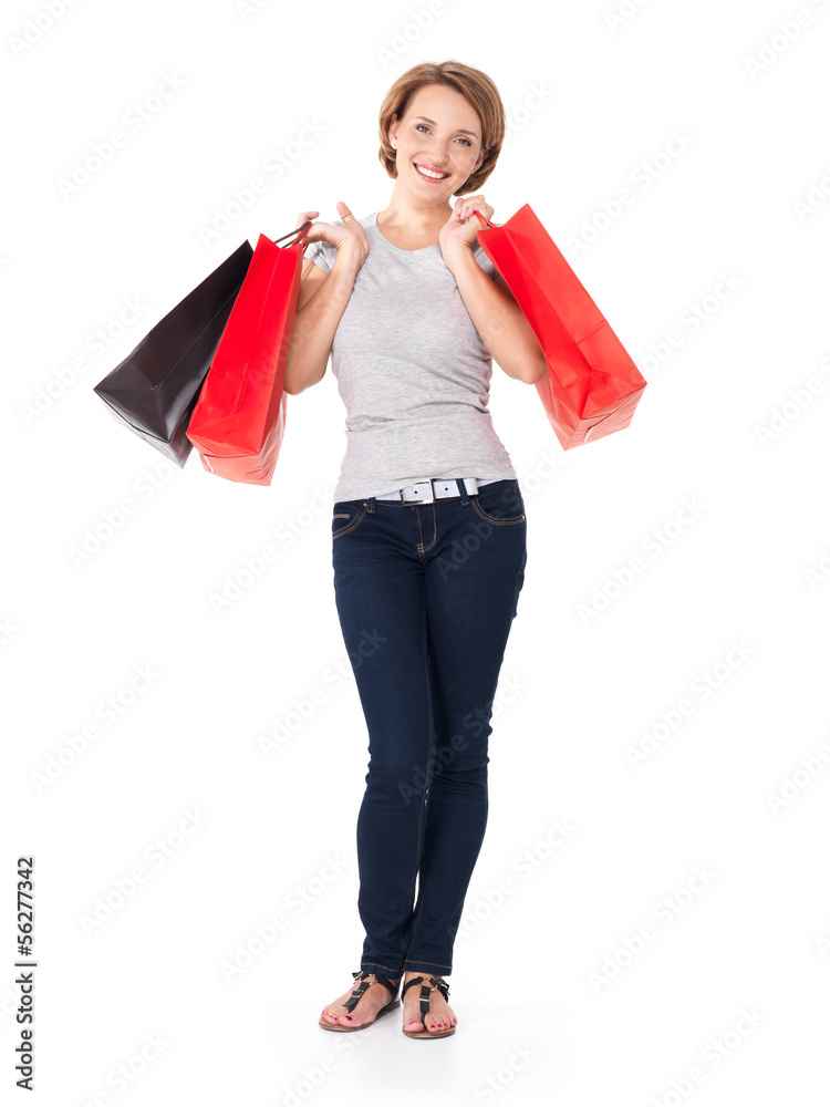 Happy young woman with shopping bags