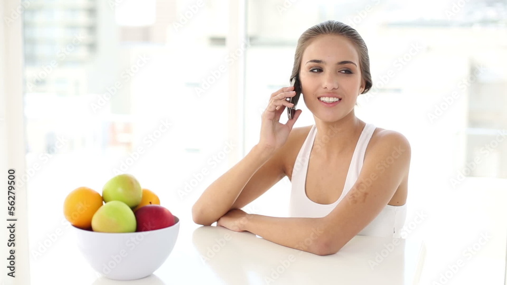 Beautiful young woman talking on her phone Beautiful young woman talking on her phone