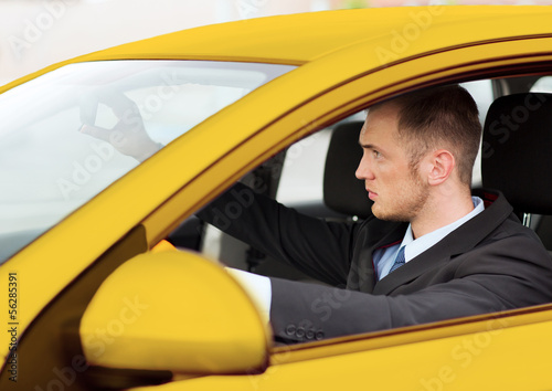 businessman or taxi driver driving a car