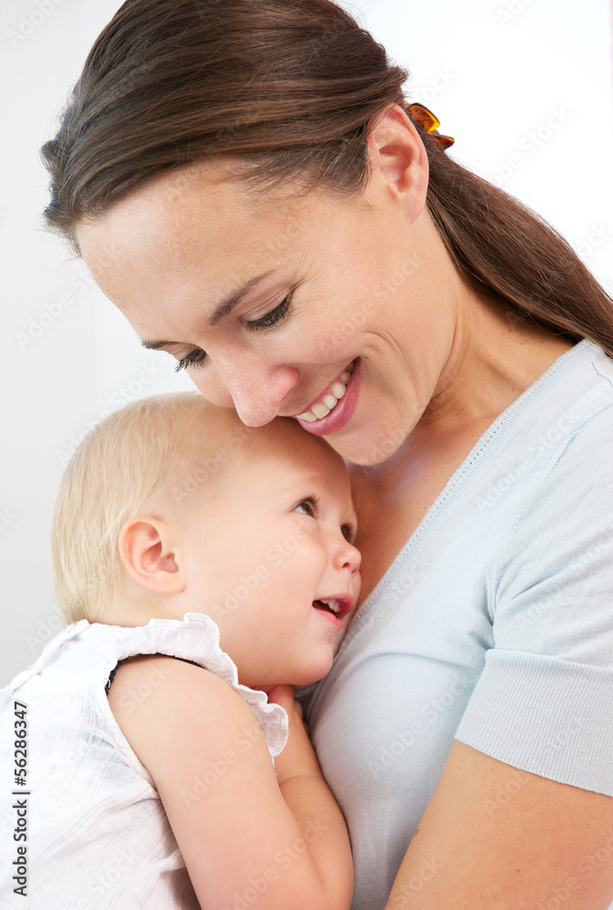 Portrait of a happy mother hugging cute baby Portrait of a happy mother hugging cute baby
