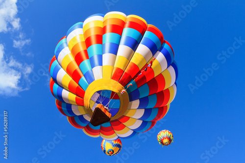 hot air balloons against blue sky