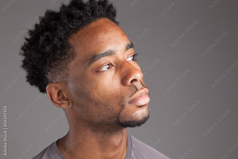 Fototapeta premium Attractive afro-american man posing in studio