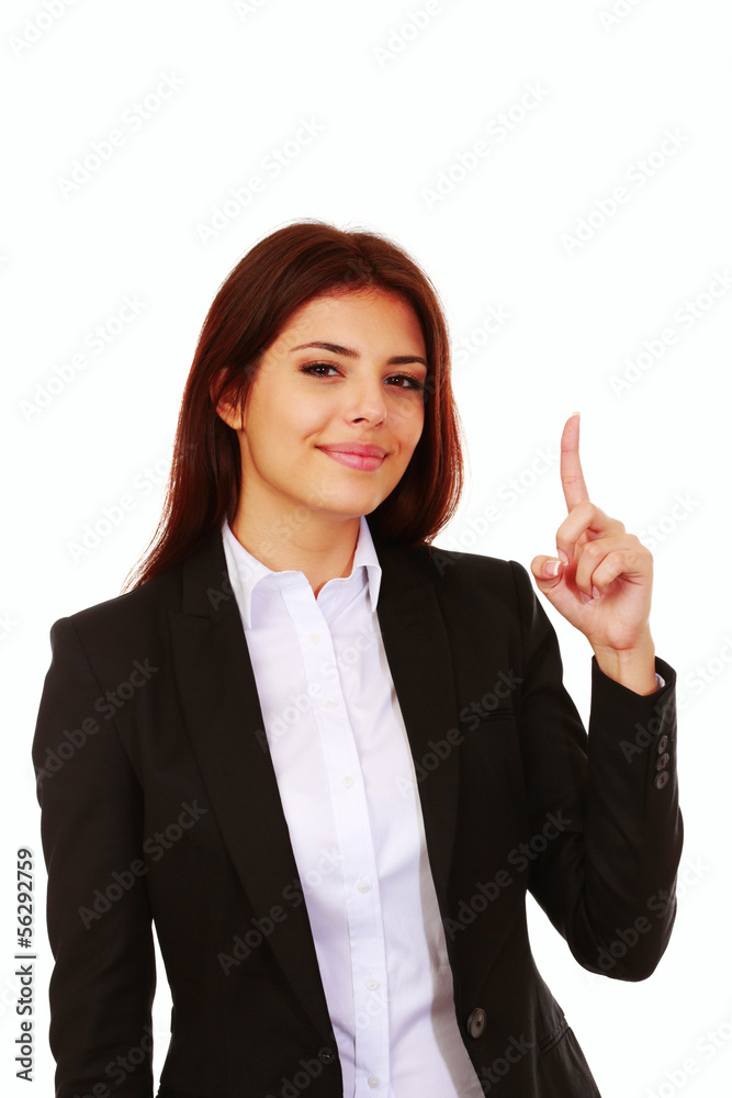 Young happy businesswoman pointing up at copyspace Young happy businesswoman pointing up at copyspace