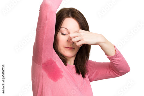 Woman sweating very badly under armpit photo