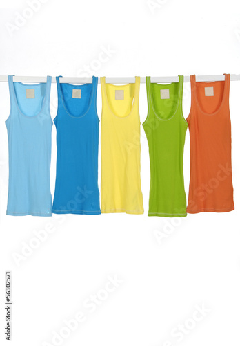 different female shirts on wooden hangers