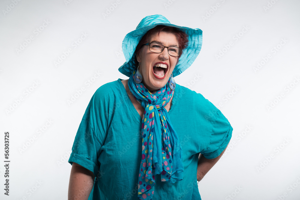Happy smiling middle aged woman with red short hair and glasses. Happy smiling middle aged woman with red short hair and glasses.