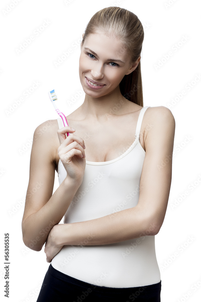 happy young blond woman with toothbrush happy young blond woman with toothbrush