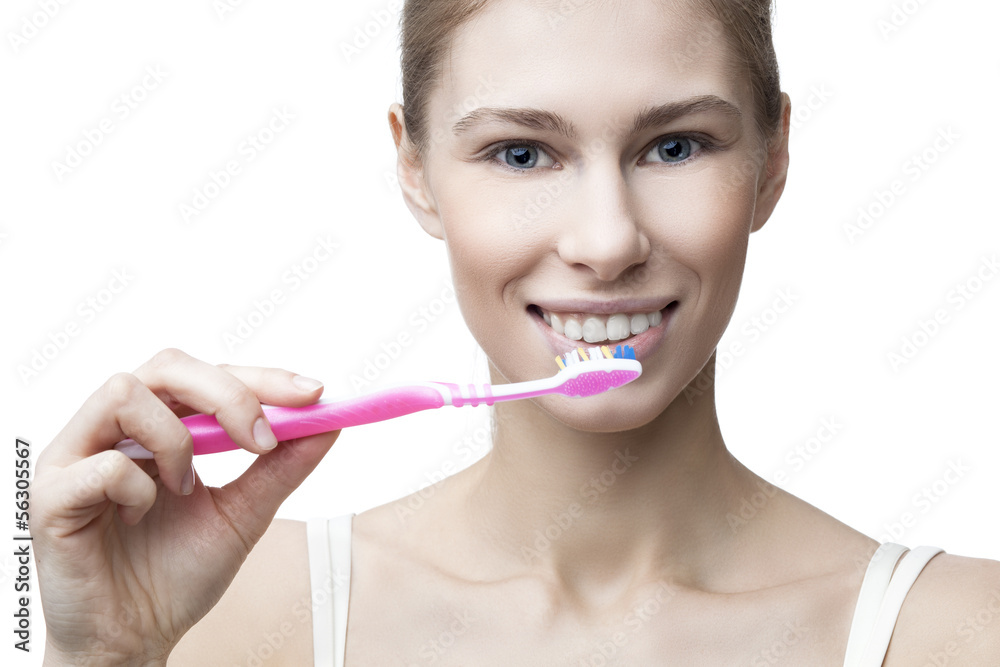 happy young blond woman with toothbrush happy young blond woman with toothbrush