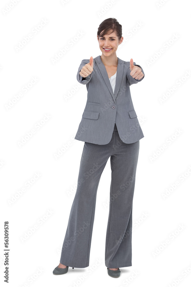 Smiling businesswoman giving thumbs up Smiling businesswoman giving thumbs up