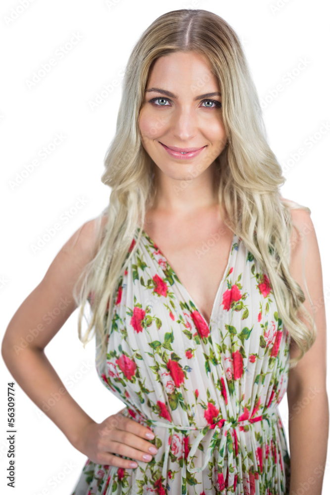Happy blonde wearing flowered dress posing Happy blonde wearing flowered dress posing