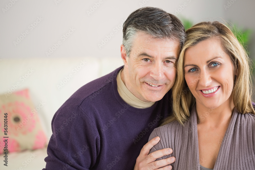 Happy couple looking at camera Happy couple looking at camera