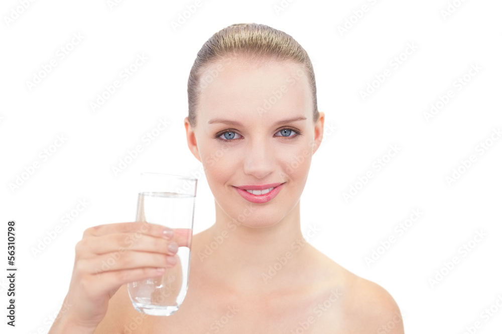 Amused pretty blonde model holding a glass of water Amused pretty blonde model holding a glass of water