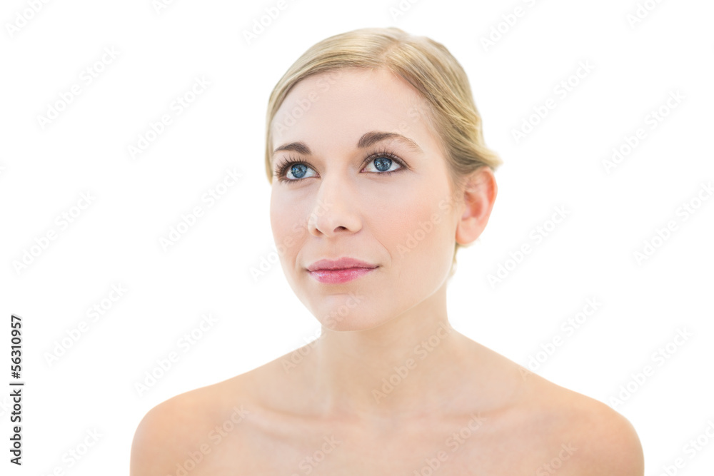 Pensive young blonde woman looking away Pensive young blonde woman looking away