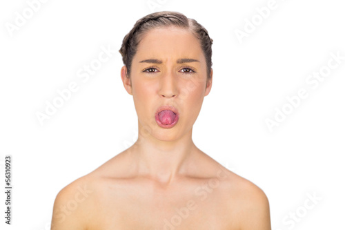 Healthy woman sticking her tongue out © lightwavemedia