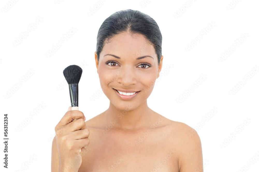 Pretty black haired model holding blusher brush Pretty black haired model holding blusher brush