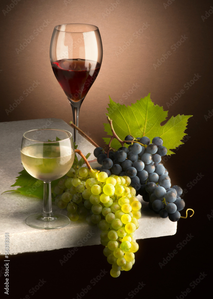 glasses of wine with grapes on the table