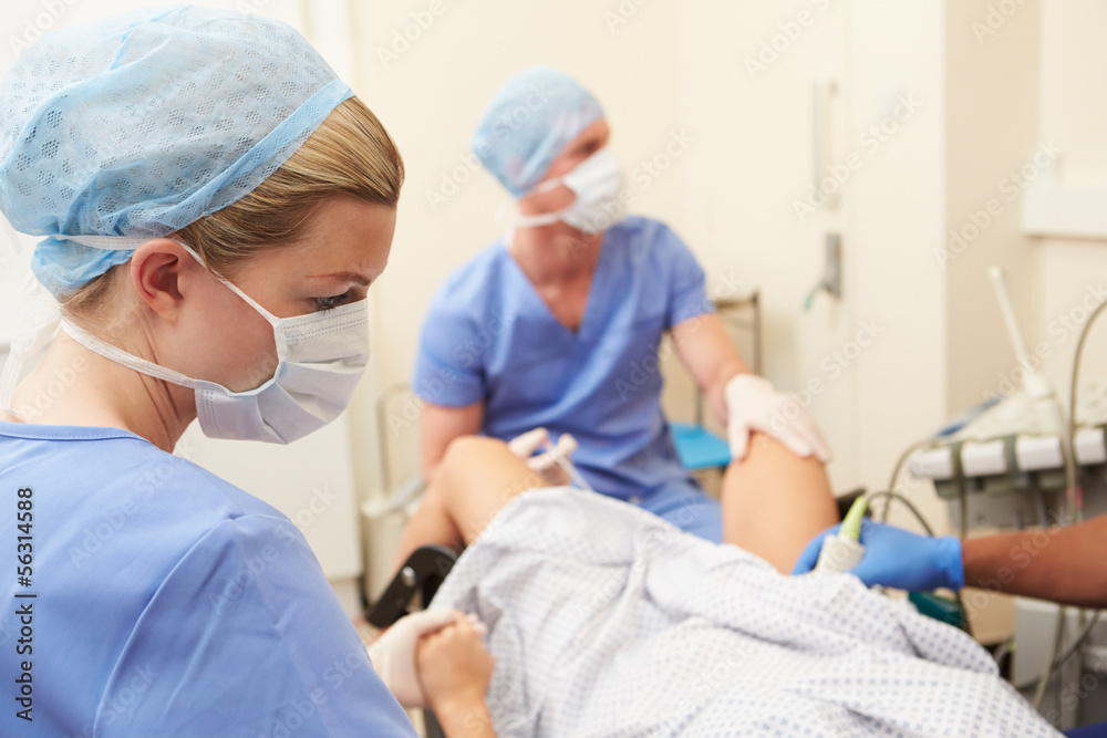 Woman Having Eggs Removed As Part Of IVF Treatment Woman Having Eggs Removed As Part Of IVF Treatment